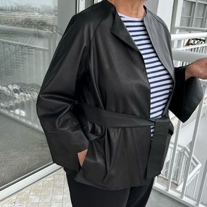 leather jacket with asymmetric sleeves and an asymmetric back slit